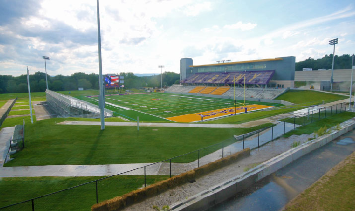 UAlbany new football field stadium endzone view with overhead sunlight