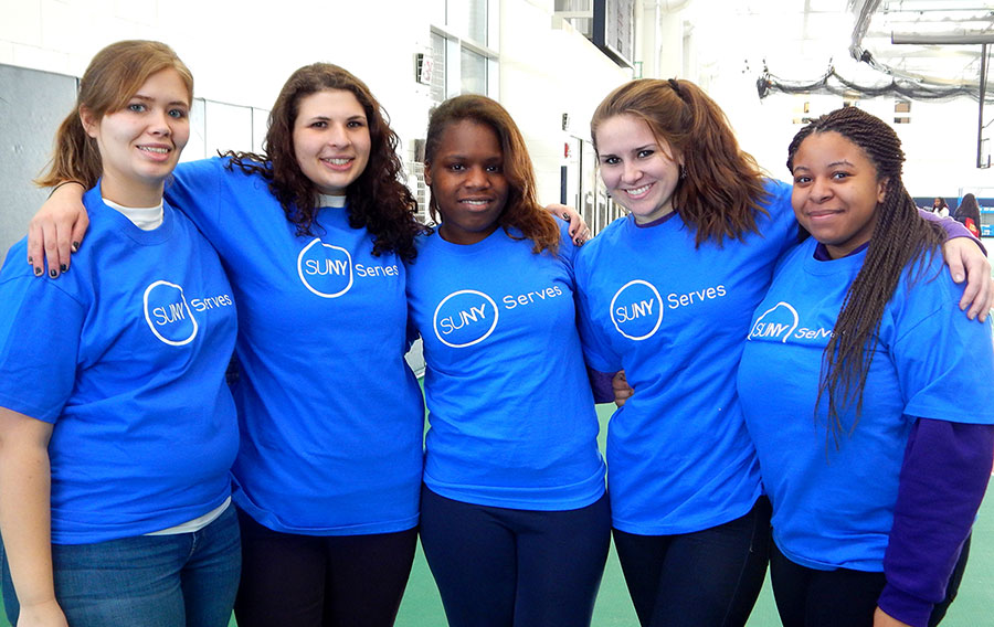 female students from Canton with SUNY Serves shirts at Martin Luther King Jr Day of Service 2014