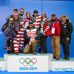 Erin Hamlin ’11, center, is surrounded by friends and family, including her brothers Ryan and Sean and parents Eileen and Ron. Kneeling is Hamlin’s coach, USA Luge Program Director and Two-time Olympic medalist Mark Grimmette.