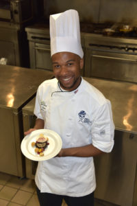 Parris Sewer, captain of SUNY Delhi's culinary team, with their award-winning dessert.