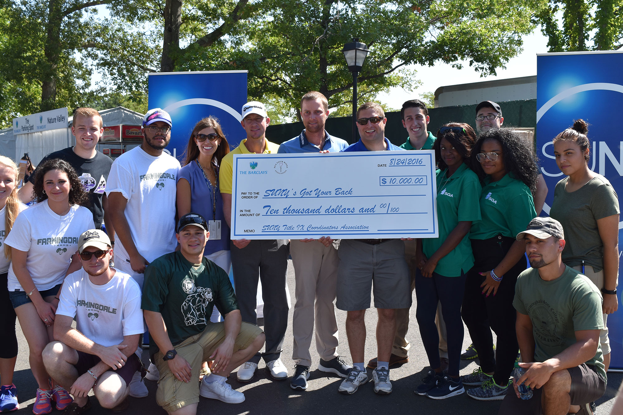 A large check is presnted to the SUNY 's Got Your Back volunteers at The Barclays.