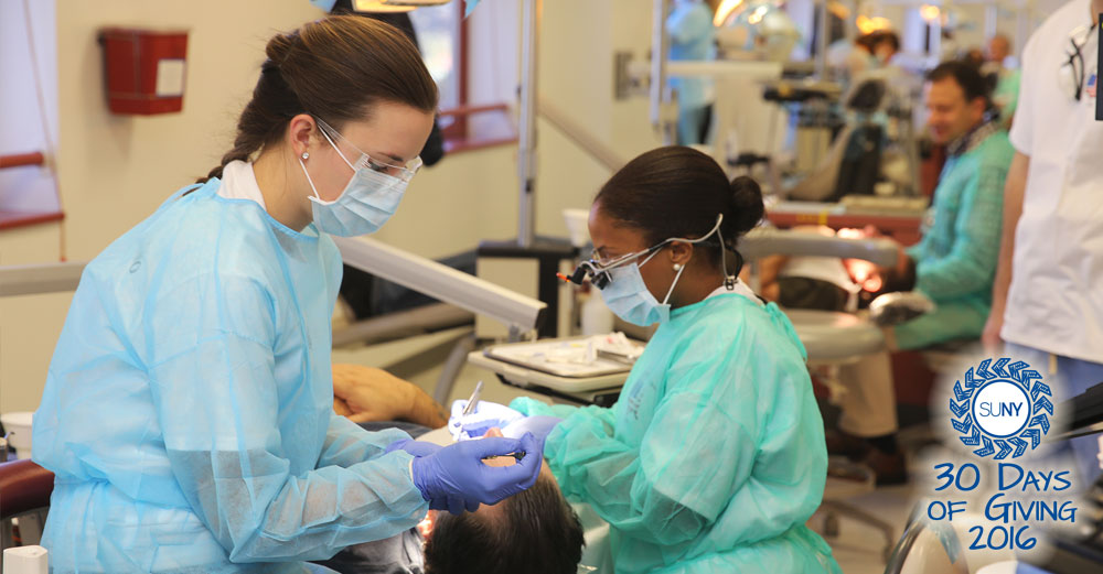 Students from University at Buffalo School of Dental Medicine give free exams to military veterans.