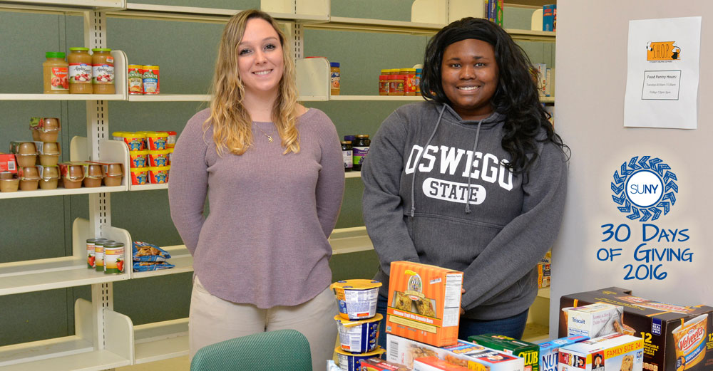 2 female volunteers in the Students Helping Oz Peers (S.H.O.P.) pantry.