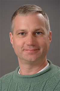Casey Raymond, Oswego professor, headshot