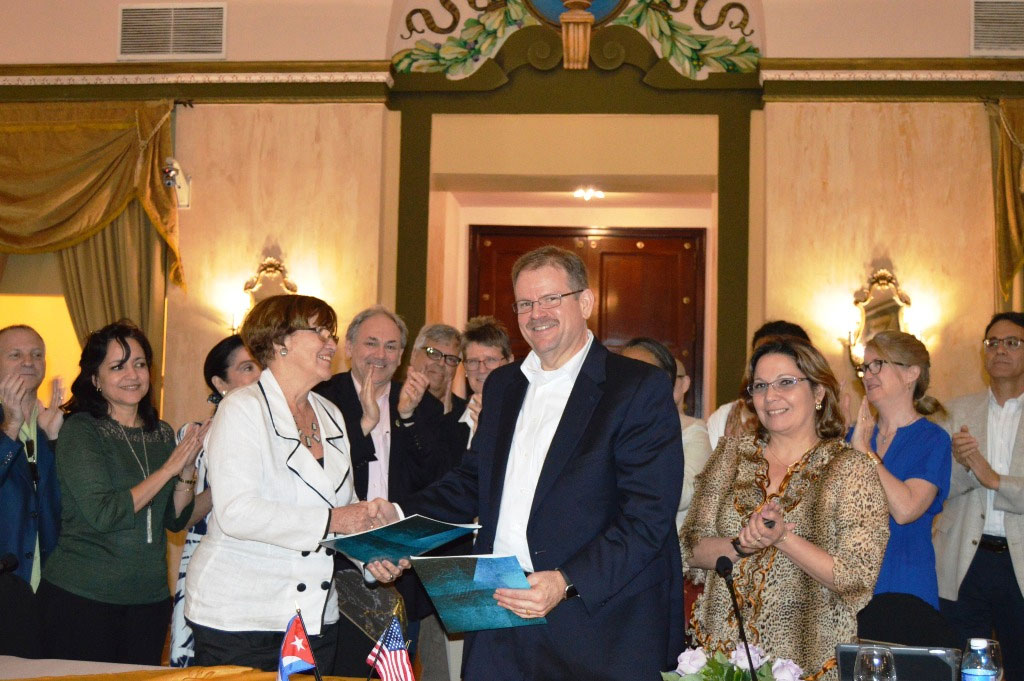 Provost Alexander Cartwright with a Cuban education minister after signing the MOU in Havana. 