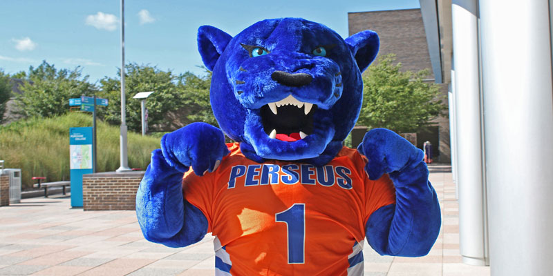 Perseus Panther flexes outside a SUNY Purchase campus building.