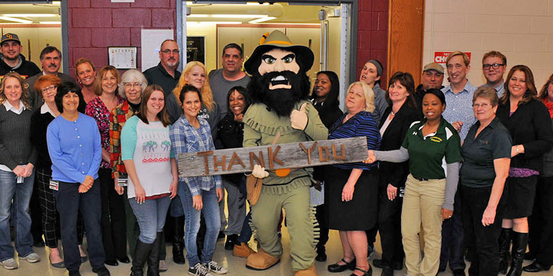 CGCC mascot RIP Van Winkle holds Thank YOu sign with many students and faculty.
