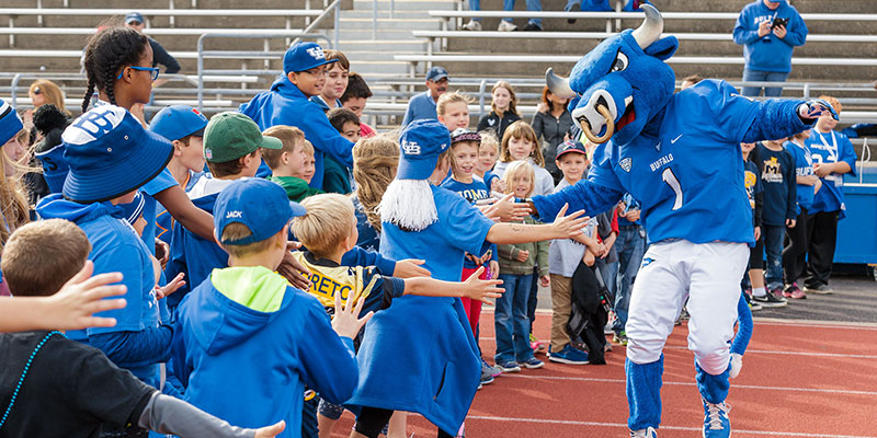 Victor E Bull of UB meeting his young fans on the field