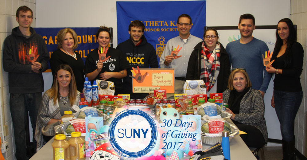 Members of the Niagara County Community College Practical Business Club and Phi Theta Kappa Honor Society and their faculty advisors put Thanksgiving baskets together.