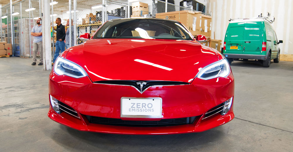 The front of a red Tesla Model S car.