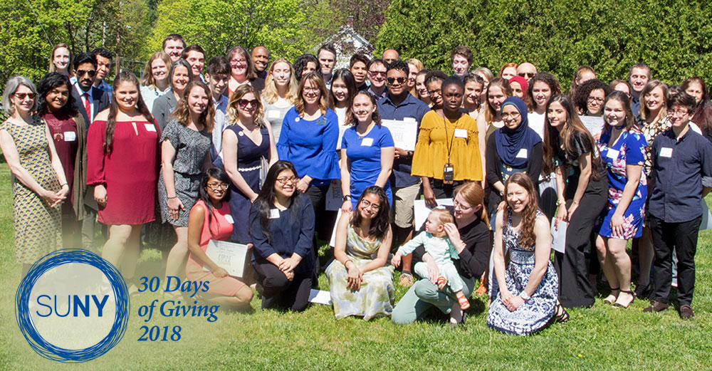 First-year interns from SUNY New Paltz pose outside with mentors.
