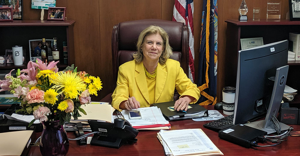 NY State Senator Shelley Mayer at her desk.