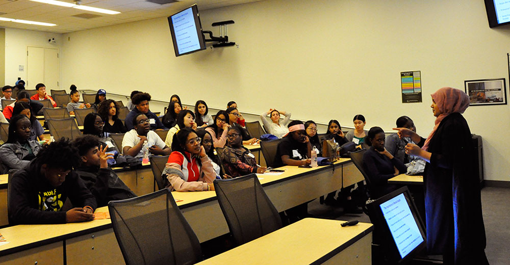 New incoming SUNY students sit in a classroom at SUNY Global Center to learn about the college experience. 