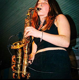 SUNY Oneonta student Hannah Goldberg playing her saxophone