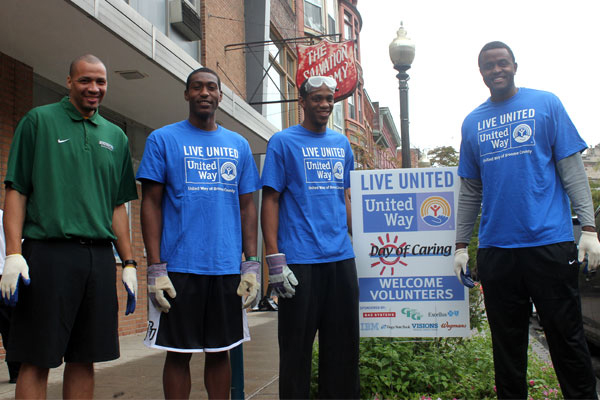 Binghamton University men's basketball players outside of the Binghamton Salvation Army during the United Way Day of Caring