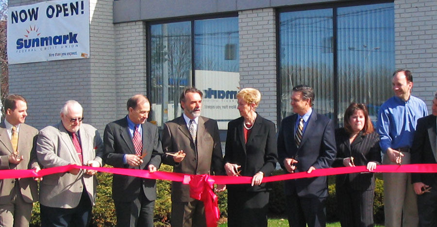 Bruce Beaudette and Sunmark FCU staff at a branch grand opening ceremony.