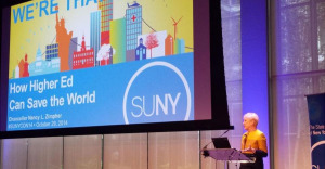 Chancellor Nancy Zimpher on stage addressing crowd at SUNYCON 2014 in NYC.