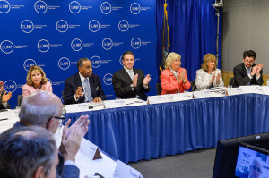 Governor Cuomo, Carl McCall and others at the meeting where the uniform policy to combat sexual assault was introduced.