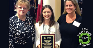 3 ladies from SUNY ESF stand with American Red Cross Outstanding Sponsor Award plaque.