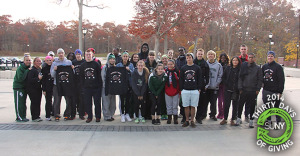 Students, faculty, and staff from SUNY Old Westbury pose for a picture after their Turkey Trot and Food Drive event.