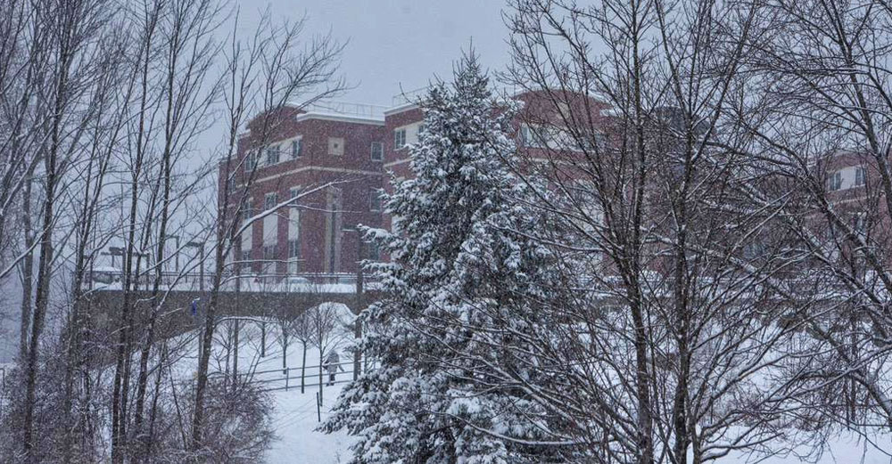 Binghamton University campus building during major snowstorm.
