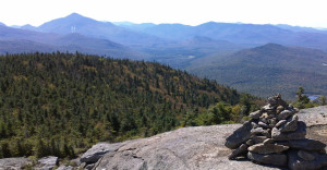 Adirondack mountains from top of rocky cliff.