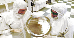2 scientisits at SUNY Poly hold 7nm wafers on display. Photo courtesy Darryl Bautista/FPS FOR IBM