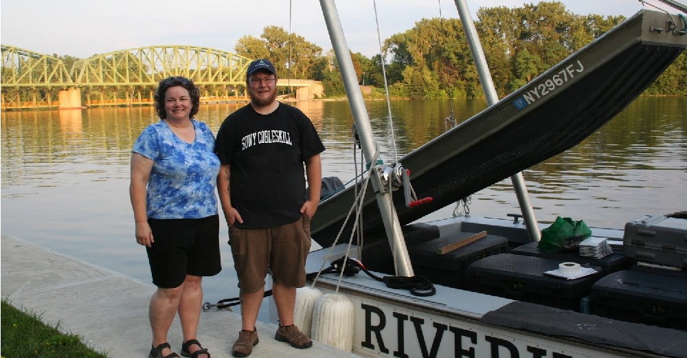 Professor Barbara Brabetz and student Jason Ratchford of SUNY Cobleskill on a dock next to Riverkeeper boat getting ready to go sample water from the Mohawk River.