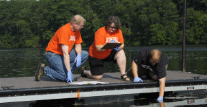 Cobleskill professors take part in water sample study in the Mohawk River.