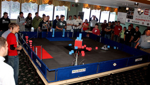 A robotics demonstration in front of large group of people at Alfred State.