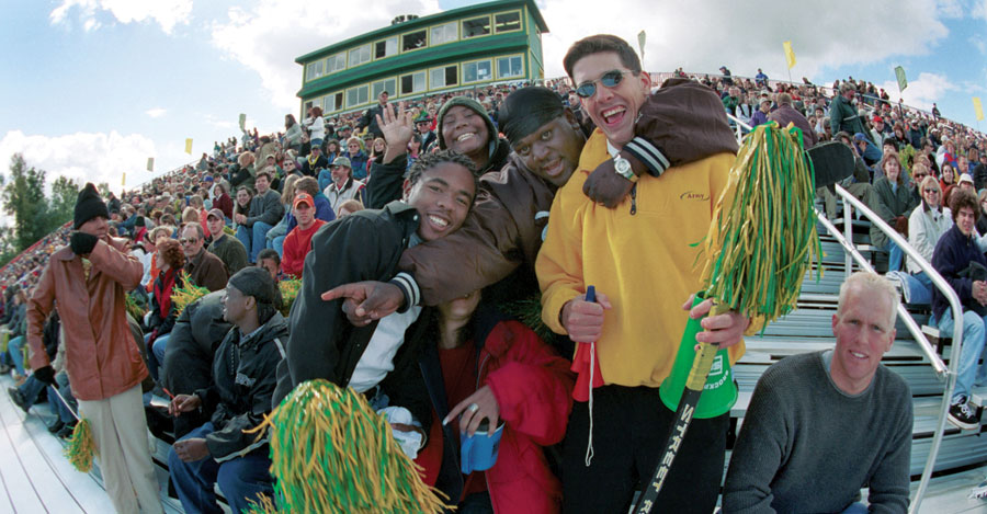 College at Brockport students in stands at football game