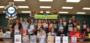 Fulton Montgomery Community College students with book donations during Literacy Matters campaign
