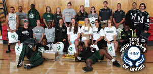 Morrisville State College students pose in gym during a Back To School charity drive.