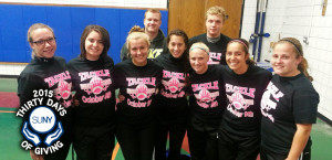 Niagara County COmmunity College students pose together after a flag football game to raise funds for breast cancer