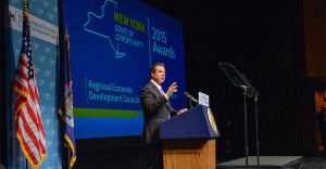 Governor Cuomo on stage at the Egg announcing REDC awards.