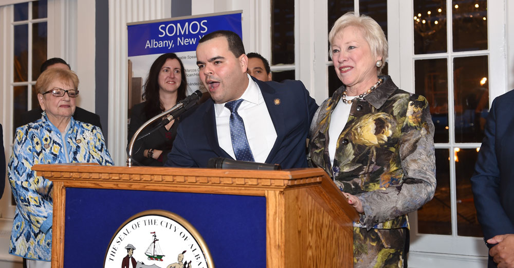 Assemblyman Marcos Crespo presents Chancellor Zimpher with the Champion of Latinos award.