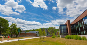 Binghamton University campus under sun-filled sky