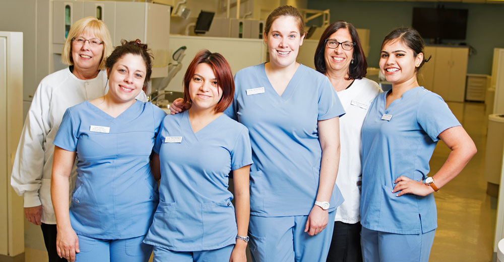 4 female students and 2 female professors from Farmingdale State dental hygiene program.