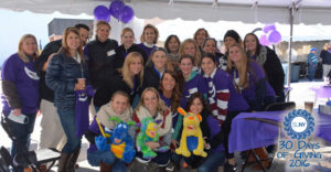 Faculty and students of the Dental Hygiene Department at Hudson Valley Community College pose in purple gear.