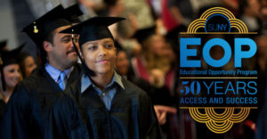 Cortland graduates in cap and gown with EOP 50 Years Access and Success logo