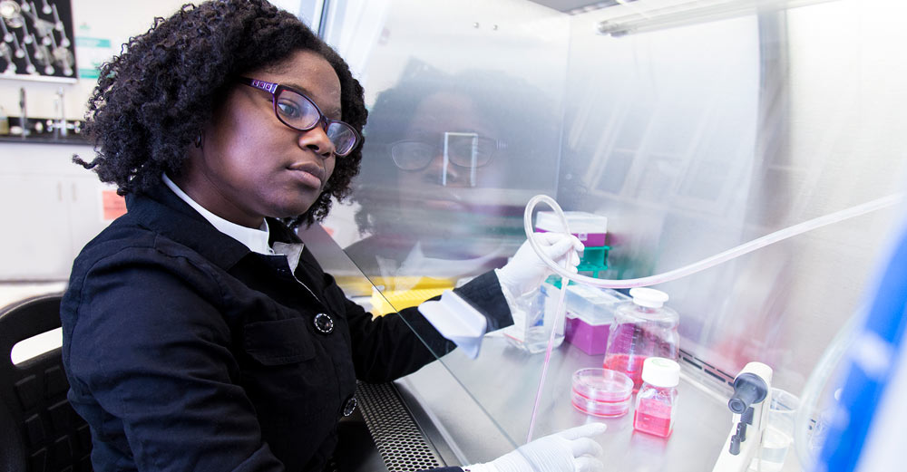 UAlbany student Marissa Louis in lab studying Zika virus