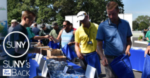 PGA Tour pros Chris Kirk and Vaughn Taylor fill comfort bags for SUNY's Got Your Bag at the 2016 Barclays Tournament at Bethpage Black.