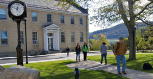 Students walk outside a building at SUNY Cobleskill
