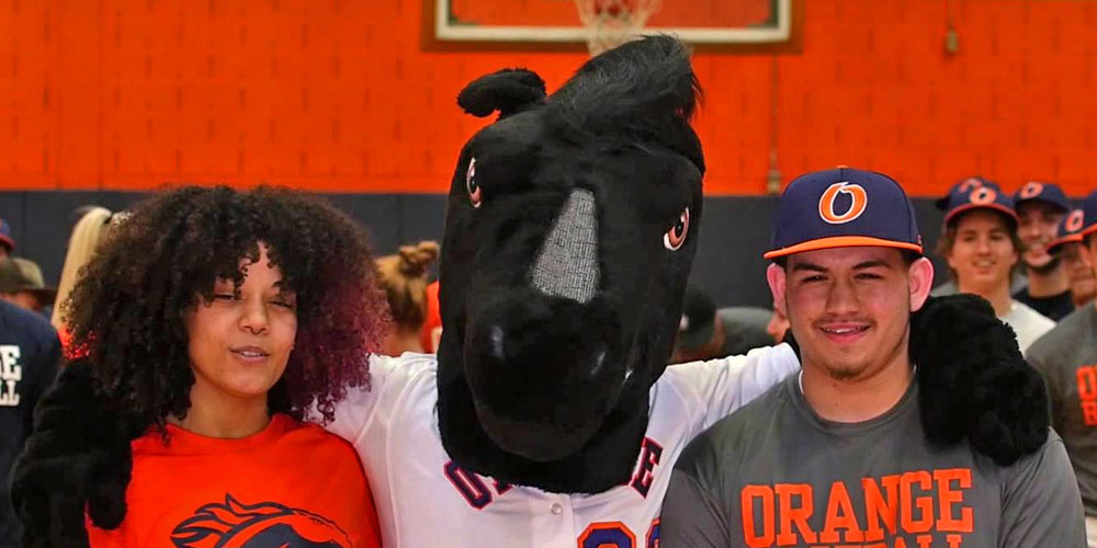 SUNY Orange COmmunity College mascot Colt with a female and male athlete at school.