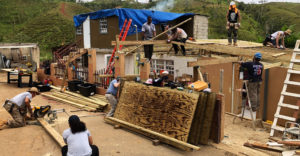 SUNY volunteers and New York tradespeople work on reconstructing a roof in Orocovis, PR about 90 minutes outside San Juan.