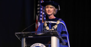 Chancellor Johnson in academic regalia speaks at her Inauguration ceremony.