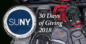 30 Days of Giving logo with backbacks in the background.