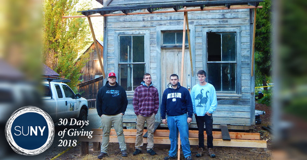 SUNY Alfred State College students stand in front of old historic building in a California mining town.