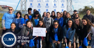 SUNY Old Westbury students and staff pose at the Long Island Autism Walk at Jones Beach.