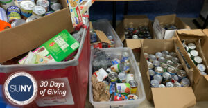 Boxes of canned and boxed food donations.